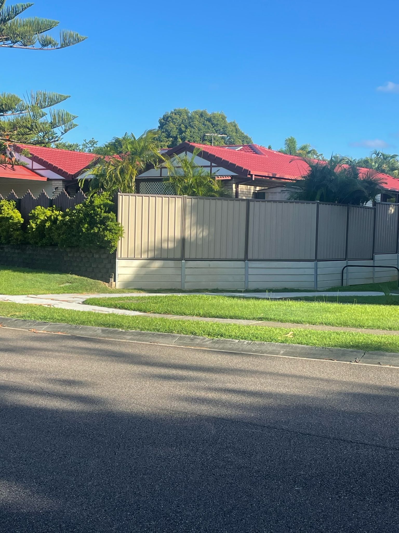 Row of restored red tile roofs seen from the street
