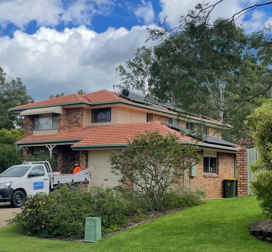 Two-storey brick home with re-pointed terracotta ridge capping